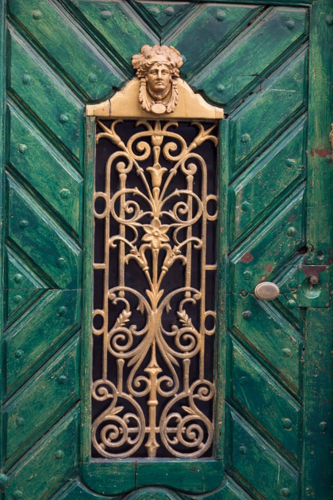 Green Door with gold decorations