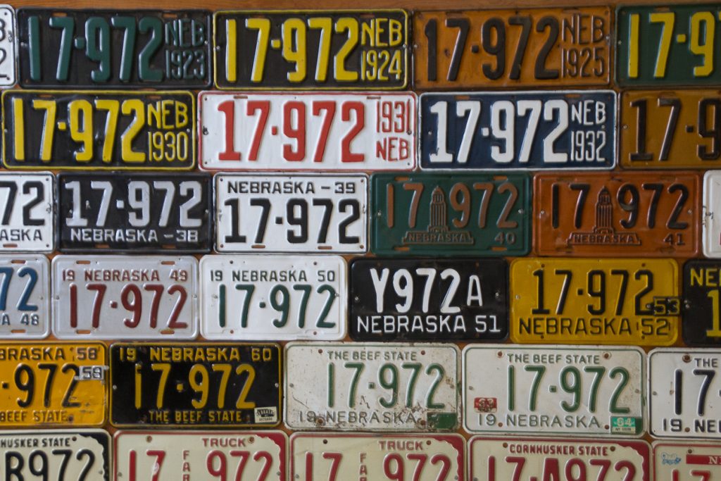 Wall of colorful license plates